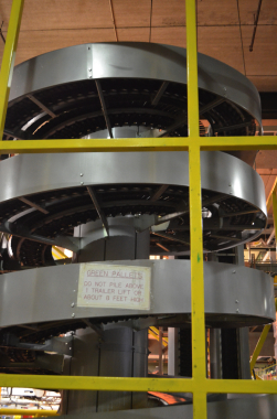 A Ryson International dual spiral conveyor is used at the end of the Moosehead packaging line to transport cases of beer bottles from an overhead line down to shipping.
