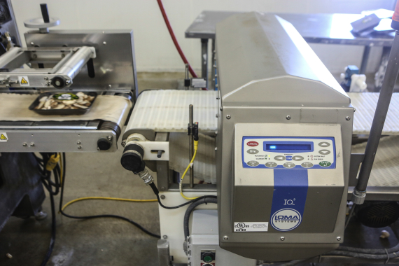 Each packed tray passes through an IQ³ metal detection system, manufactured by Loma Systems, to check for foreign particles and possible contaminants.