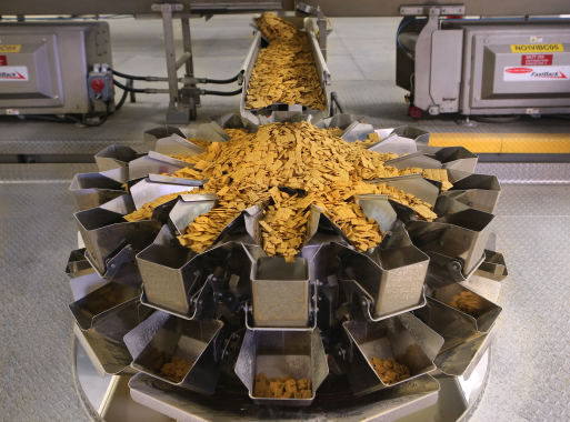 Crispy, sweet squares of multigrain cereal move through an Ishida weighscale manufactured by Heat and Control at the Post Foods Canada 200,000-square-foot plant in Niagara Falls.