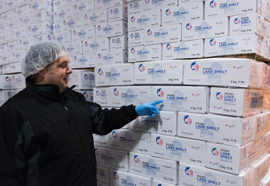 Company president John Neate inspects one of the many highly-stacked loads of product being kept at a perfect freezing temperature of -18°C inside the plant’s expansive cold-storage warehouse while awaiting shipment to foodservice and retail customers.