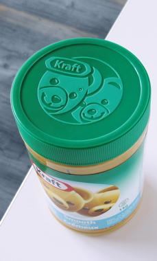 Each jar of different Kraft Peanut Butter flavors is topped off with a color-matching lid embossed with a graphic of the iconic brand’s mascot bears. 