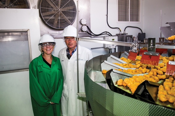 Kate Galbraith joins the Lunenburg plant’s manufacturing business partner John Mills by the Ishida weighscales dispensing exact portions of fish strips and nuggets.