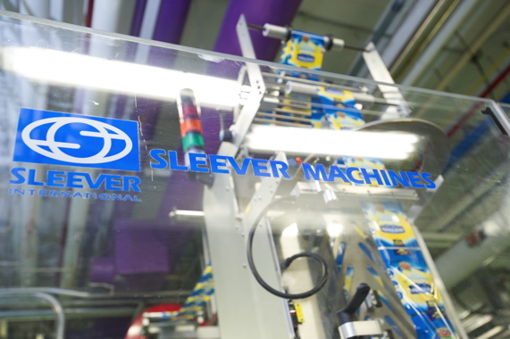 A new high-speed shrinksleeving machine from Sleever International used to decorate the new squeeze-bottles.