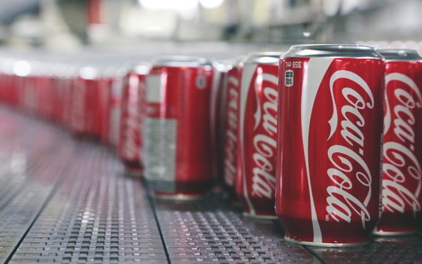Manufactured by the Ball Packaging production facility in Whitby, Ont., the lightweight 355-ml aluminum cans of Coca-Cola are automatically rinsed and conveyed towards filling stages just above a high-volume blower positioned underneath to remove all excess moisture from the cans.