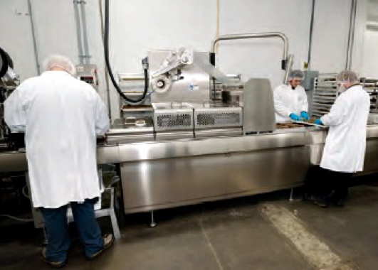 The Multivac R175 vacuum-sealing machine at the Maillard facility boasts compact design and many hygienic features to maintain a highly sanitary working environment for optimal product safety and integrity. (see above and below)