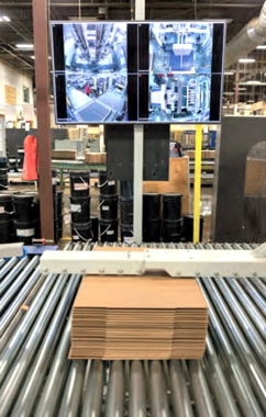 Large video monitors provide end-of-line operators at the Mitchel-Lincoln facility in St-Laurent with unobstructed views of all the process stages taking place in the forming and transferring of large stacks of corrugated boxes towards the plant’s shipping area. (Also see below)