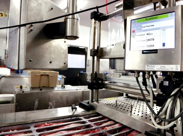 Set atop the VC999 iSeries thermoform machine, a Videojet coding machine applies best-before dates and lot code data onto the as-yet-to-be-applied top web film of the pork tenderloin packs.