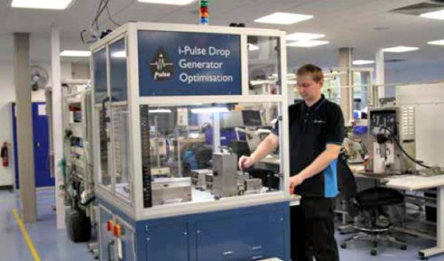 A Cambridge plant employee carrying out quality assurance tests on the i-Pulse printhead.